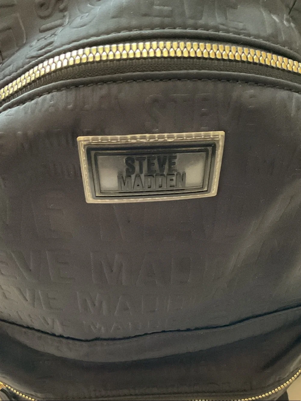 Steve Madden Black Embossed Logo Backpack with Gold Zipper